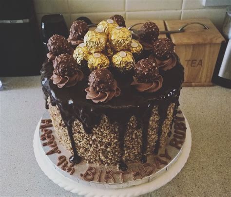Decorate with ferrero rocher truffles, chopped hazelnuts and chocolate. Ferrero Rocher Cake - CakeCentral.com