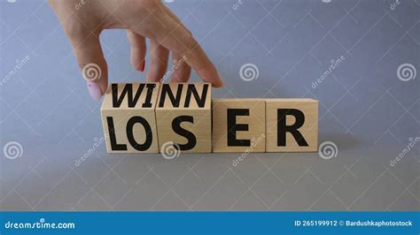 Winner And Loser Symbol Businessman Hand Turnes Wooden Cubes And