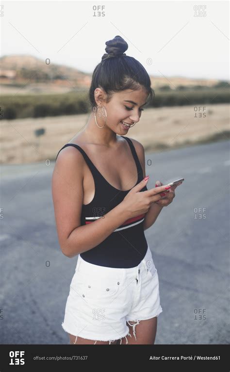 Teenage Girl Using Smartphone Outdoors Stock Photo Offset