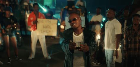 watch naira marley fall in love in the playful video for chi chi