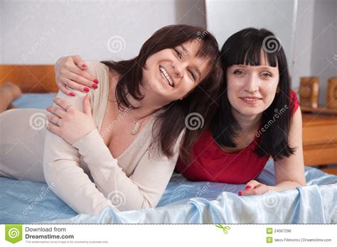 Two Women Having Fun On Sofa Royalty Free Stock Image