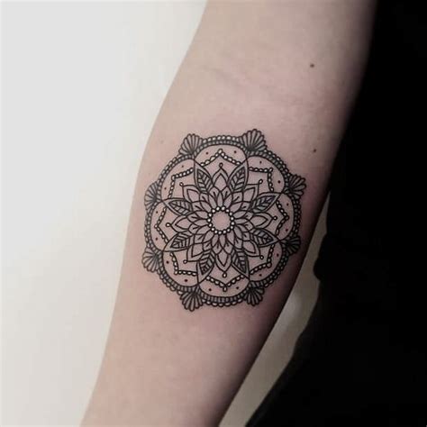 Small tattoos are perfect alternatives for people who love the idea of body art but do not want to overdo it. Simple and beautiful mandala tattoo with white dots inked ...