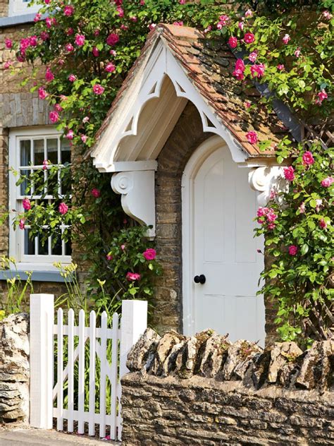 Beautiful Rose Covered Cottage With Painted Cream Door And Matching