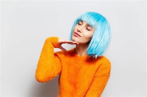 Premium Photo Portrait Of Pretty Girl With Blue Hair In Orange
