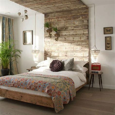 In this master bedroom, a portion of an old windmill serves as a headboard. 50 Rustic Bedroom Decorating Ideas - Decoholic