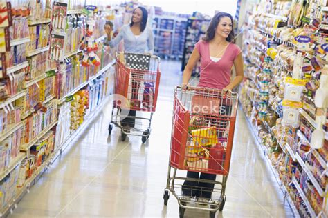 Women Grocery Shopping In Supermarket Royalty Free Stock Image