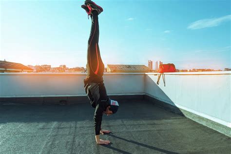 Boy Doing A Handstand On A Terrace Photograph By Cavan Images Fine
