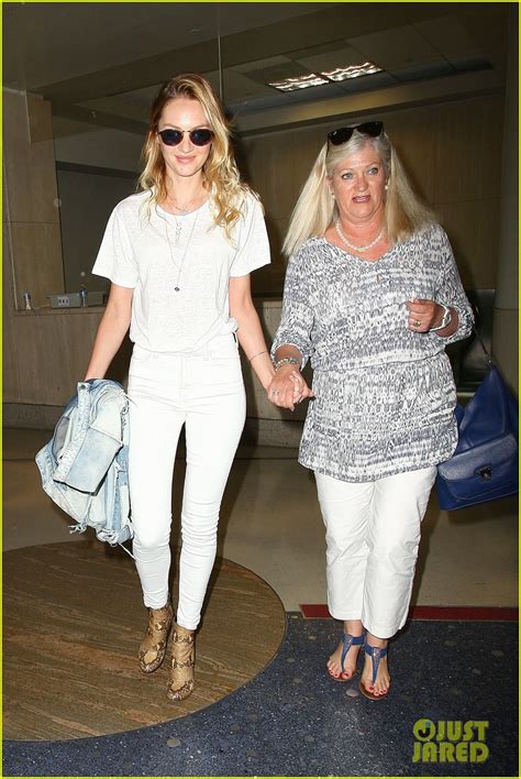 A Candice Swanepoel And Mom Eileen Hold Hands At Lax Airport Photo
