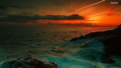 Red sunset over the green sea wallpaper | Red sunset, Sunset, Beautiful sunset