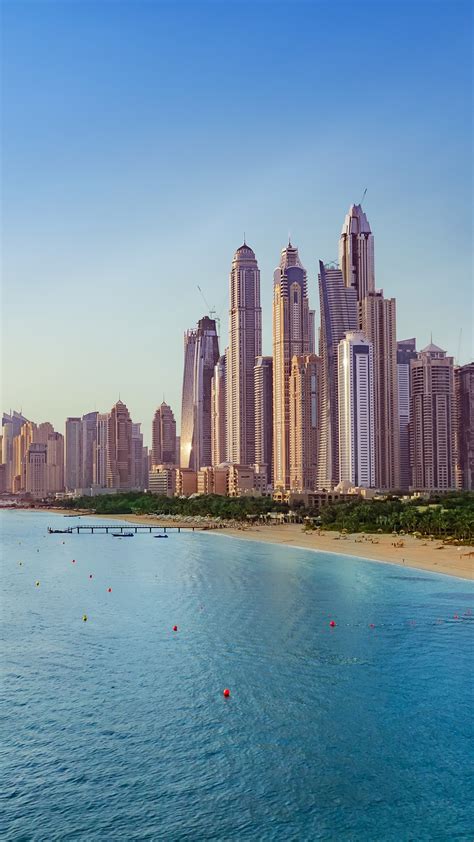 beach with boats near dubai marina with view on the skyline uae windows spotlight images