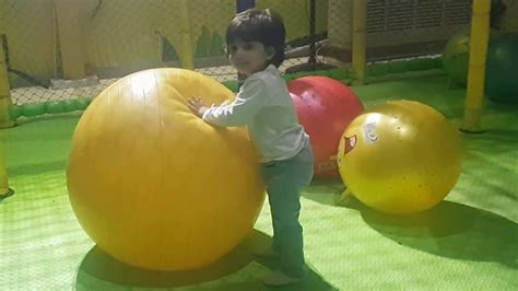 Kids Playing With Giant Balls And Slides At Play Center Youtube