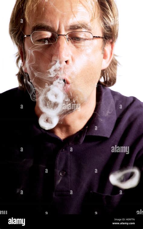 Smoker Blowing Smoke Rings Stock Photo Alamy