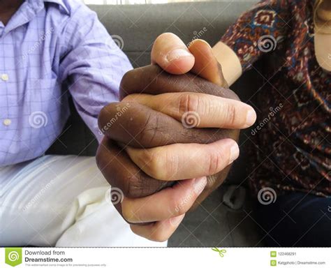 Black And White Hands Together Showing Teamwork And Diversity Stock