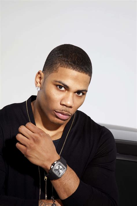 download nelly shirtless with a fierce expression with name wallpaper