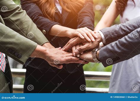 Close Up Of Business People Hands Stacking As Teamwork Leadership