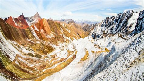 A Sweeping View Into The Andes Mountains From Vinicunca Mountain Peru