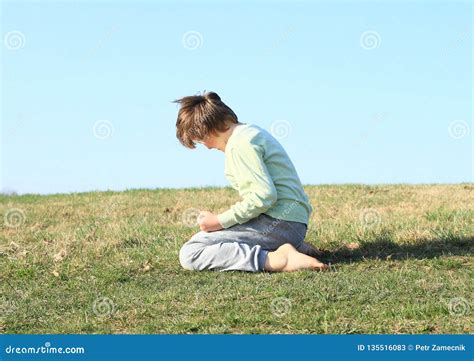 Boy Kneeling Stock Photo 21862110