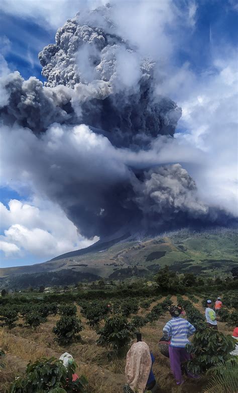As lava and ash continue to be a threat, entire towns. Volcanic Eruption: Mount Sinabung Spews Massive Ash Cloud