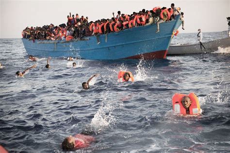 Thousands Of Refugees Rescued From Boats Off Coast Of Libya The Independent The Independent