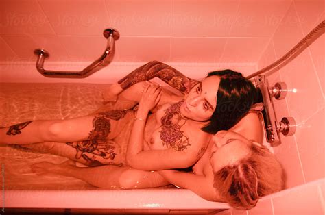 Two Lesbian Women In A Bathtub Red Flash By Stocksy Contributor