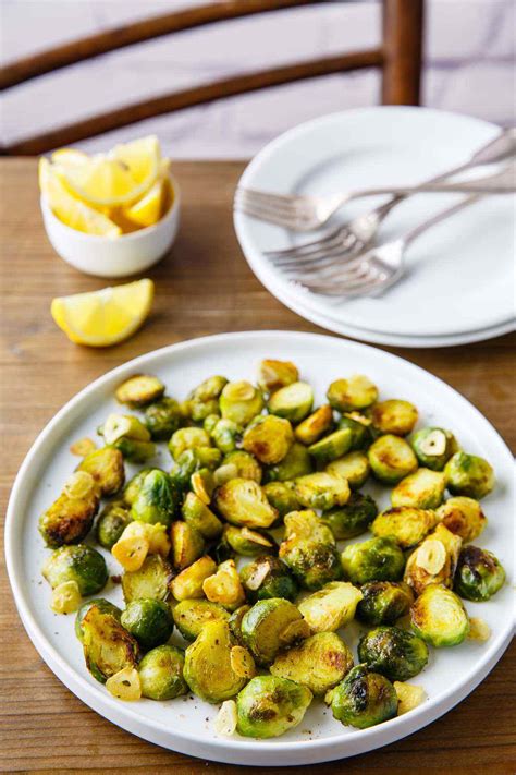 Buffalo crusted brussels sprouts > chicken wings. Pan Fried Brussels Sprouts with Garlic and Lemon - Paleo Grubs