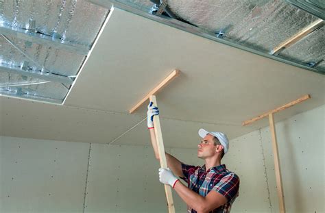 Drywall ceiling repair for large holes cut a rectangle around the damaged area. How To Hang Drywall on Ceilings • Tools First