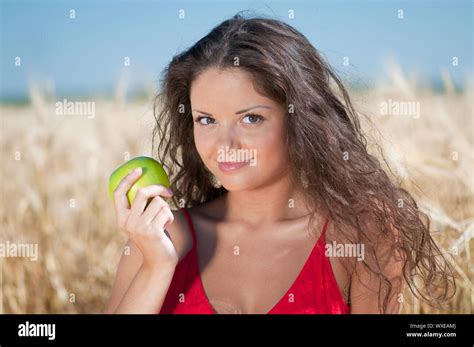 Beautiful Woman With Perfect Hair And Skin Posing In Wheat Field And