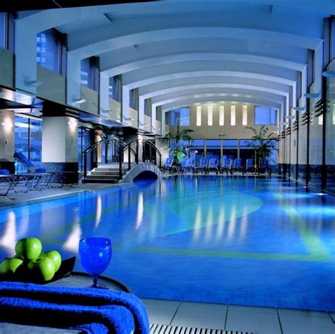 Luxury Indoor Swimming Pool Design With Elegant Lighting On The Wall As