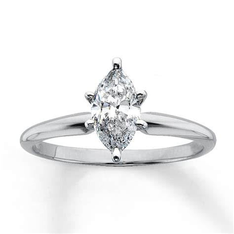 A halo of round diamonds encircles the center to add even more brilliance. Diamond Solitaire Ring 1 carat Marquise 14K White Gold|Kay | Engagement rings marquise, Marquise ...