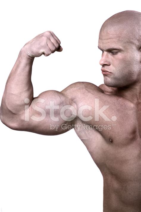 Man Flexing Biceps To Show Off His Strength Stock Photo Royalty Free