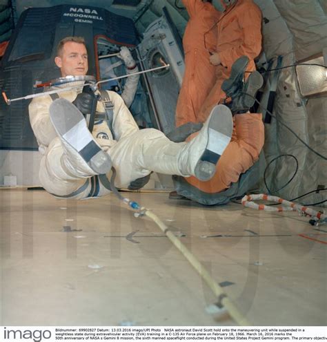 Nasa Astronaut David Scott Hold Onto The Maneuvering Unit While