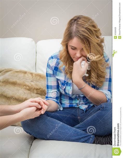 Hands Of Mother Consoling Sad Teen Daughter Crying Stock