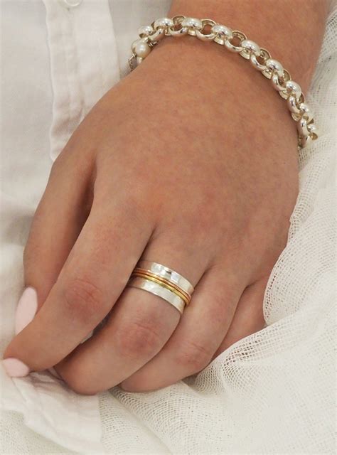 Love britty fidget meditation spinner ring in silver — jewellery co