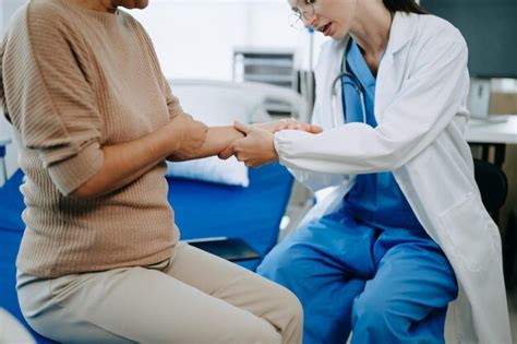 Premium Photo Doctor And Senior Female Patient Who Lie On The Bed