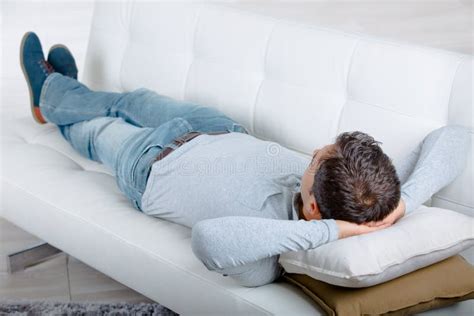 Young Man Laying On Sofa Stock Photo Image Of Film 117258454