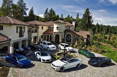 A Look At Some Mansions With Expensive Cars Parked In Front Homes Of