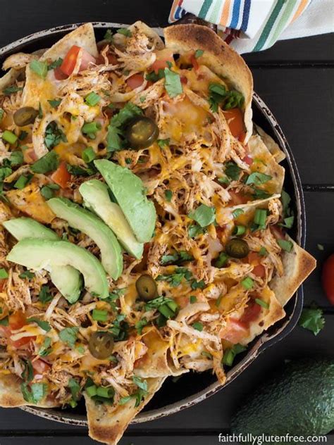Chicken nachos is everything you know and love about nachos, made with juicy shredded mexican chicken! Easy Chicken Nachos - Faithfully Gluten Free