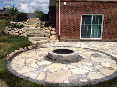 Canadian Flagstone Patio With Brick Paver Accent Brick And Unilock Fire