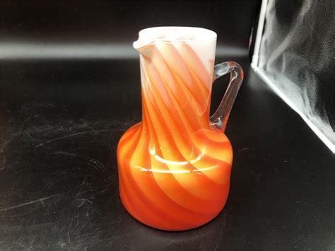 Urban Auctions Assorted Orange Glassware