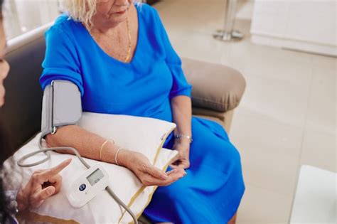 Premium Photo General Practitioner Checking Blood Pressure Of Patient