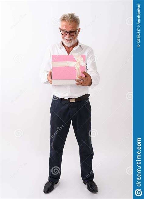 Full Body Shot Of Happy Senior Bearded Man Smiling And Standing Stock