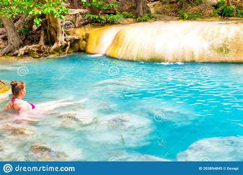 Young Woman Swims In Emerald Blue Lake Erawan National Park Thailand