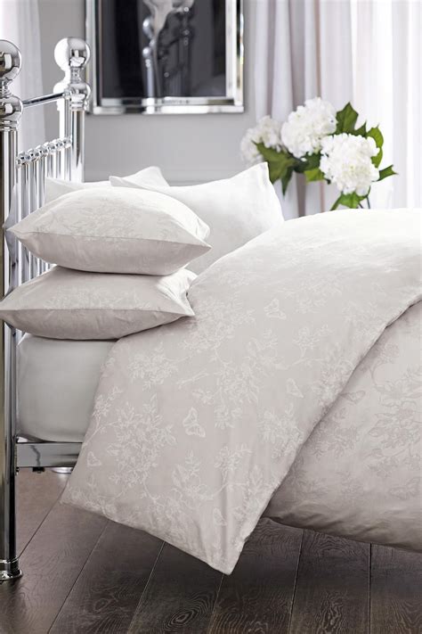 Good quality white bedroom furniture. Buy Cotton Butterfly Jacquard Bed Set from the Next UK ...