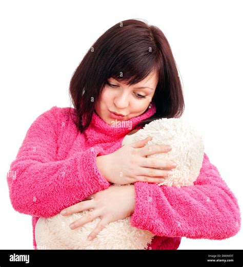 Young Woman In Pink Bathrobe Cuddling With Her Teddy Bear Stock Photo