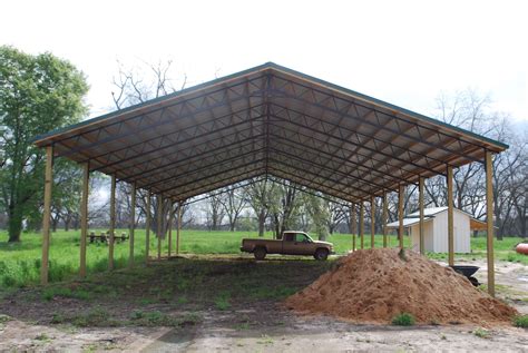 The cost returned is based on concrete footings poured around the posts, steel clear span trusses, and 26 gauge painted metal for the roofing and siding. Open Shelter and Fully Enclosed Metal Pole Barns | Smith-Built