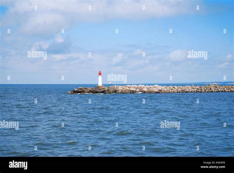 Lighthouse In A Jetty Pier Stock Photo Alamy