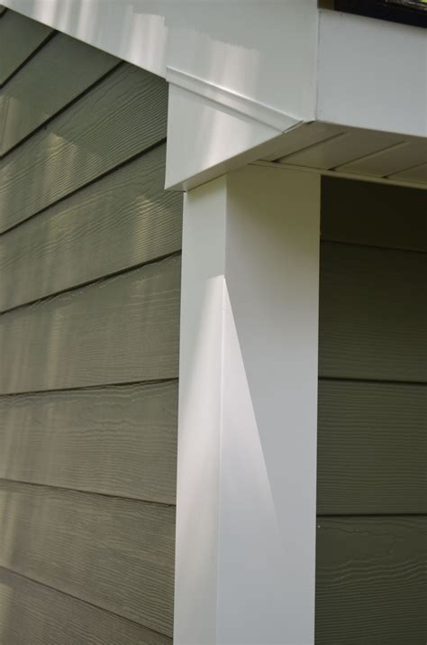 The Corner Of A House With Siding On It