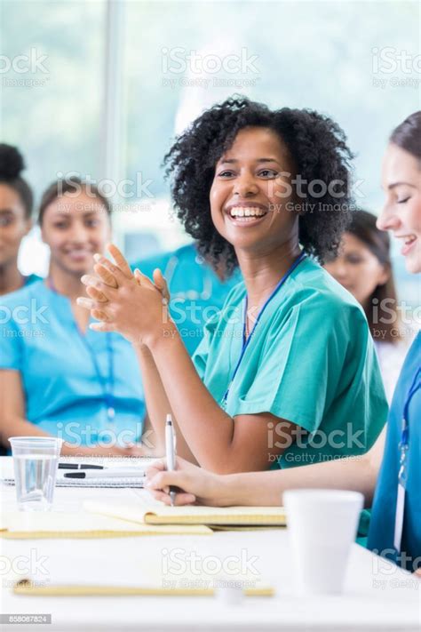 Beautiful African American Nurse Enjoys Attending Healthcare Seminar