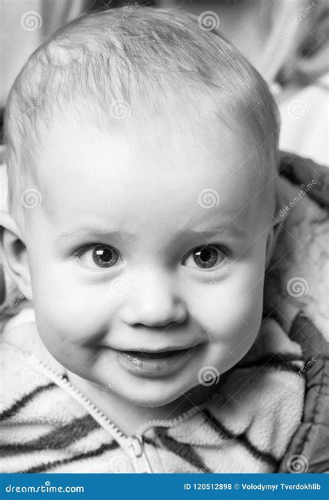 Joyful Child Cute Happy Baby Boy With Smiling Face Laying Stock Photo