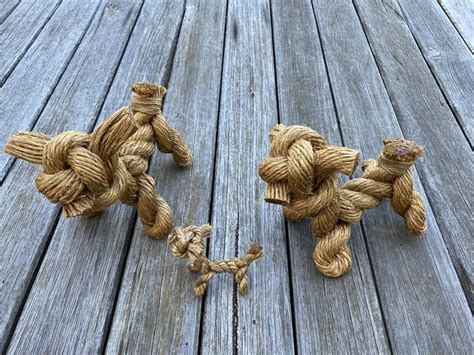 Three Small Rope Bears On A Wooden Deck